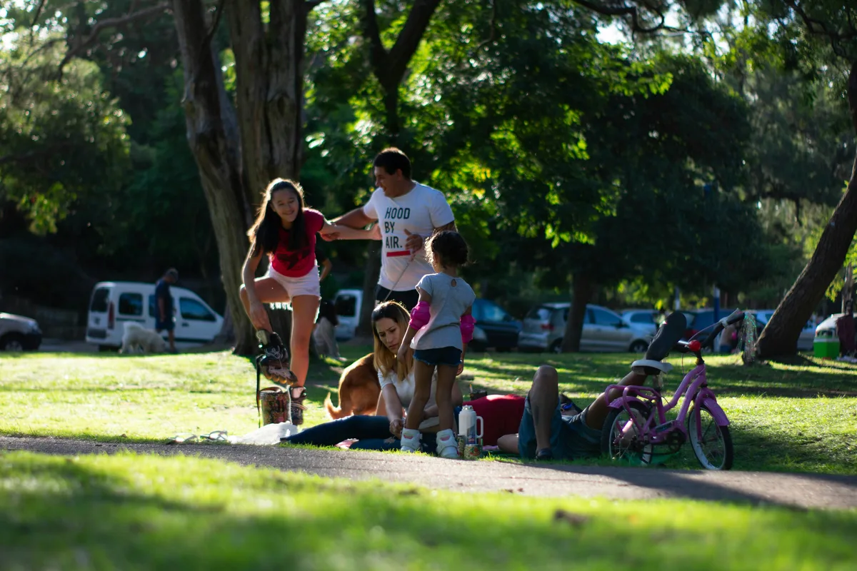 Co-parents walking with their child — how 50/50 custody changes child support